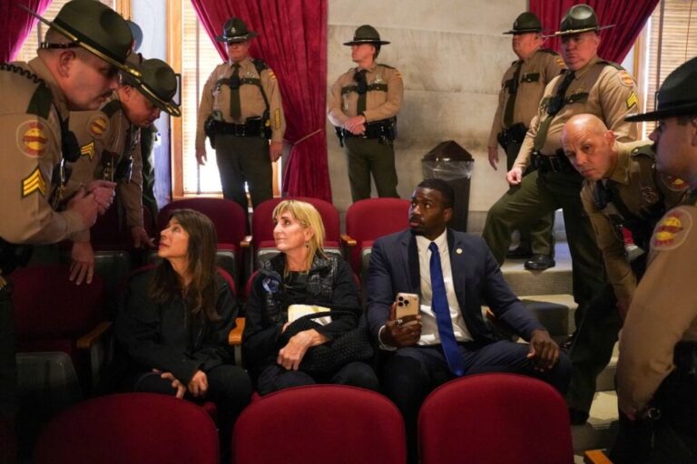 State troopers ask KeShaun Pearson, brother of Democratic state Representative Justin J. Pearson, and two women demonstrators to leave the House gallery as they protest efforts by the state's Republican leadership in redistricting congressional election maps on the last day of a special session in Nashville, Tennessee, U.S., May 7, 2026.