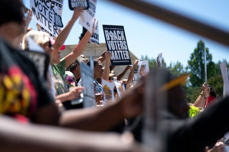 Demonstrators gather on the South Carolina statehouse steps in Columbia, during a rally in opposition to congressional redistricting held on May 14.