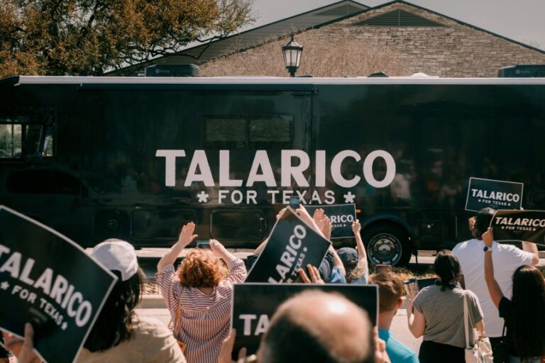 The campaign bus for Talarico arrives at a campaign event during the Texas primary eleciton in Round Rock, Texas.