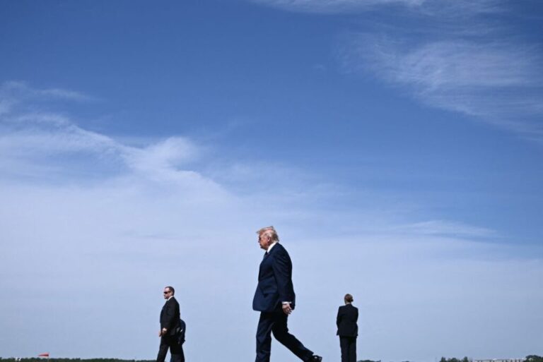President Donald Trump walks as he arrives at Morristown Airport in New Jersey on May 22.