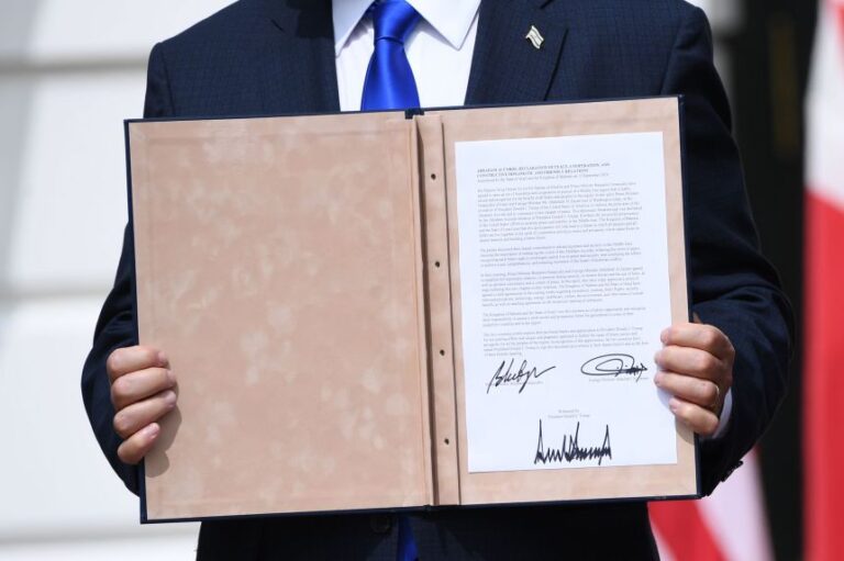 Israeli Prime Minister Benjamin Netanyahu holds up a document after participating in the signing of the Abraham Accords, at the White House on September 15, 2020.