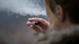 PRODUCTION - 26 January 2023, Baden-W'rttemberg, Stuttgart: A woman smokes an e-cigarette downtown. Photo by: Marijan Murat/picture-alliance/dpa/AP Images