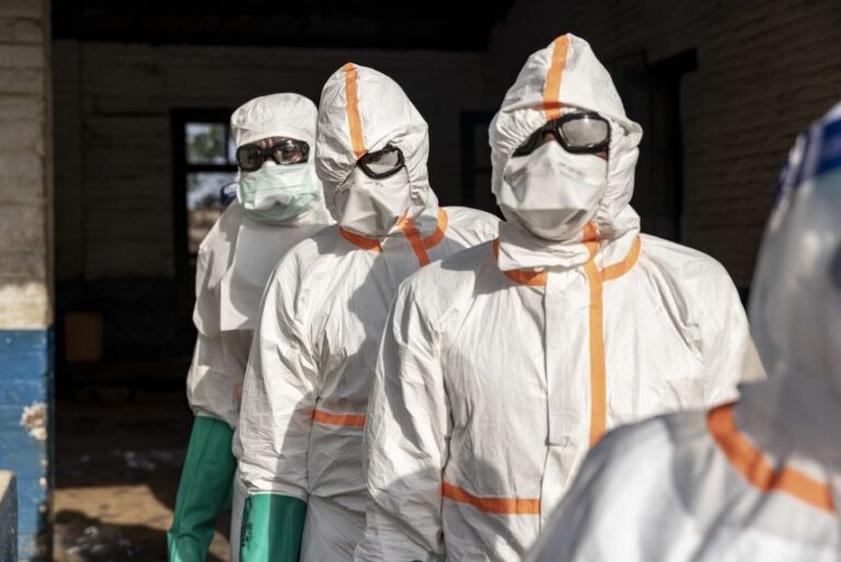 Workers disinfect their equipment at General Referral Hospital of Mongbwalu in Ituri province, in the eastern DRC, on Wednesday, after the Ebola disease tore through communities there.