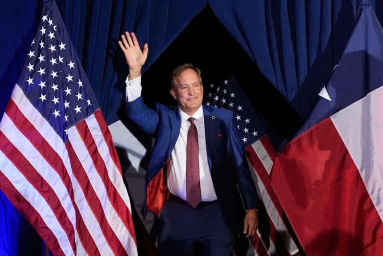 Texas Attorney General and Republican candidate for Senate Ken Paxton waves as he takes the stage during a primary runoff election night event in Plano, Texas, on May 26.