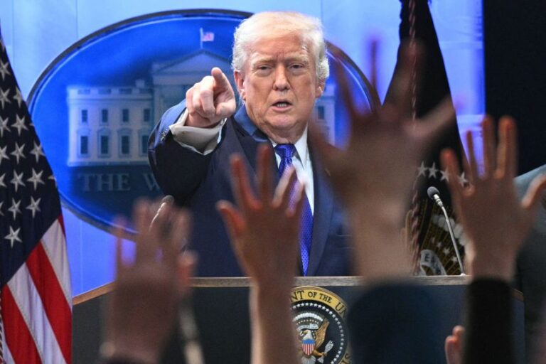 Members of the media raise their hands to ask questions to US President Donald Trump during a press conference in the Brady Press Briefing Room of the White House in Washington, DC, on February 20, 2026. (Photo by Mandel NGAN / AFP via Getty Images)