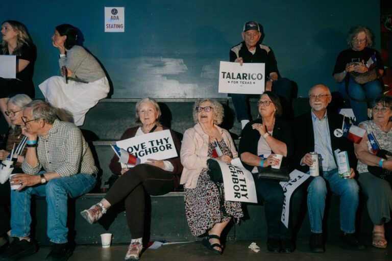 Attendees hold