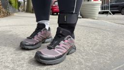 A woman wearing an ankle support brace.