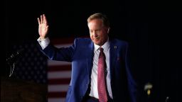 Texas Attorney General Ken Paxton waves as he takes the stage to speak during a primary runoff election night event in Plano, Texas, on Tuesday, May 26.
