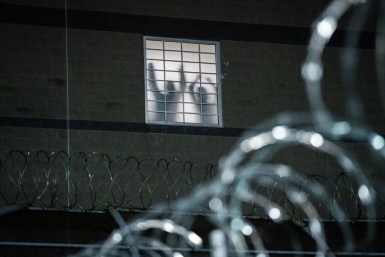 Detainees stand by a window inside the federal immigration center at Delaney Hall in Newark, where ICE is housing detained immigrants on May 26, 2026 in Newark, New Jersey. T