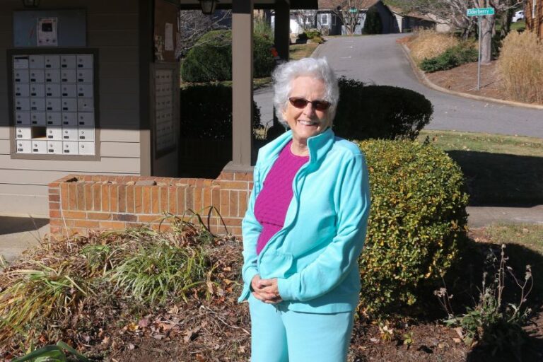 Nancy Miller-Green takes an afternoon walk around her neighborhood at Hawthorne Villages, where the pod is based.