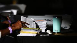 An employee of the Fulton County Board of Registration and Elections processes ballots in Atlanta, Georgia, on November 5, 2020.
