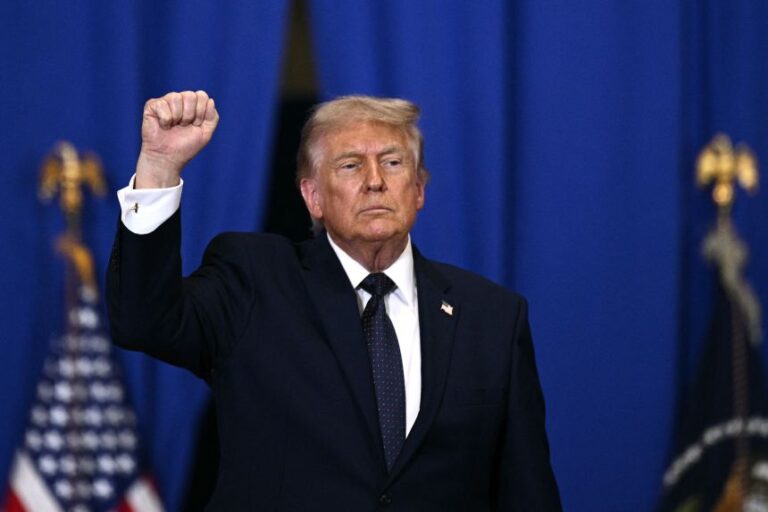 President Donald Trump raises a fist as he departs a speech about the economy at Rockland Community College Fieldhouse in Suffern, New York, on May 22.