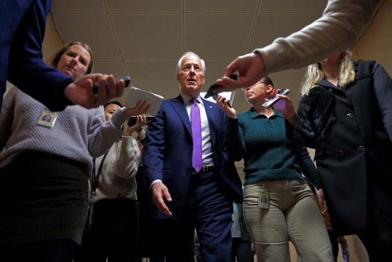 Sen. John Cornyn speaks with reporters as he arrives at the US Capitol for an all-night