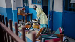 Staff members at CBCA Virunga Hospital prepare rooms intended for possible Ebola cases following official announcements in Goma on Sunday.