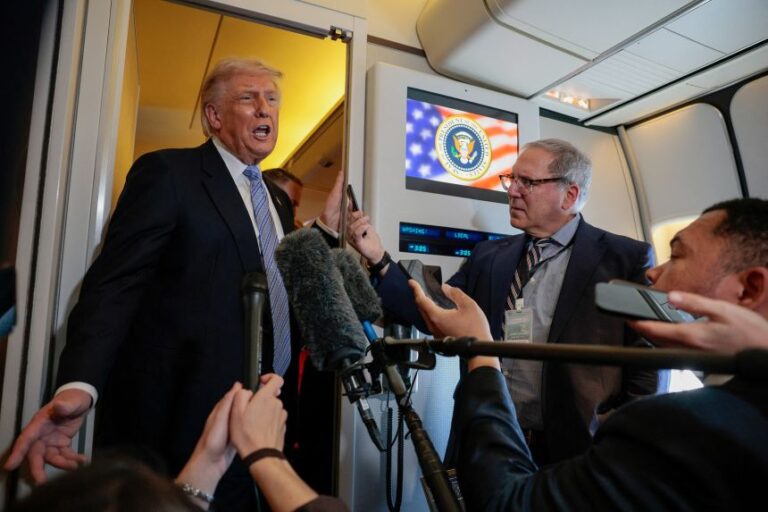 President Donald Trump speaks to the press on Air Force One on his return from China on May 15.