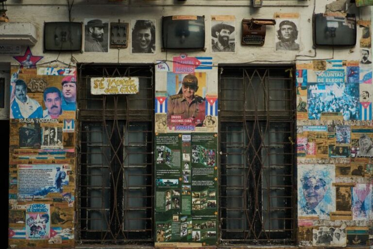 A building that houses an art installation on the Cuban Revolution features photos of former Cuban President Raúl Castro, in Havana, Cuba, on Tuesday.