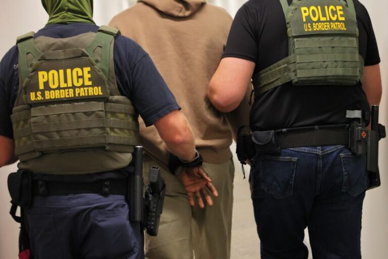 Federal agents detain a man after his court hearing in immigration court at the Ted Weiss Federal Building on July 9, 2025 in New York City.