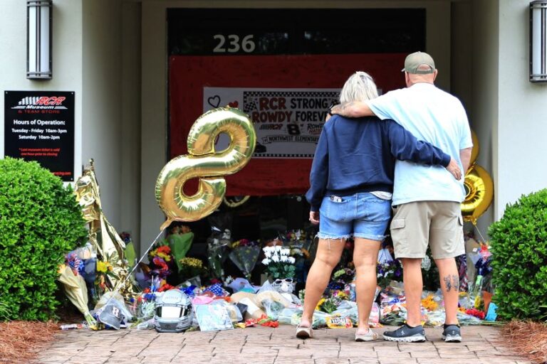 Fans gather at the memorial outside of the entrance to the Richard Childress Racing Museum, where items have been placed in memory of Kyle Busch on May 23 in Welcome, North Carolina.