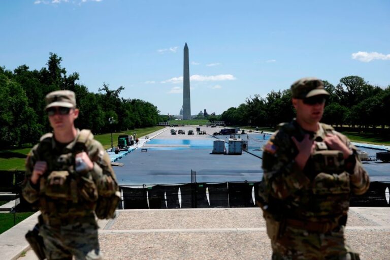 Workers apply a blue protective coating as part of a renovation project to the Lincoln Memorial Reflecting Pool on May 8, 2026.