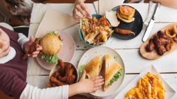 You can introduce new foods to your kids without forcing them to eat something they don't like, experts say.