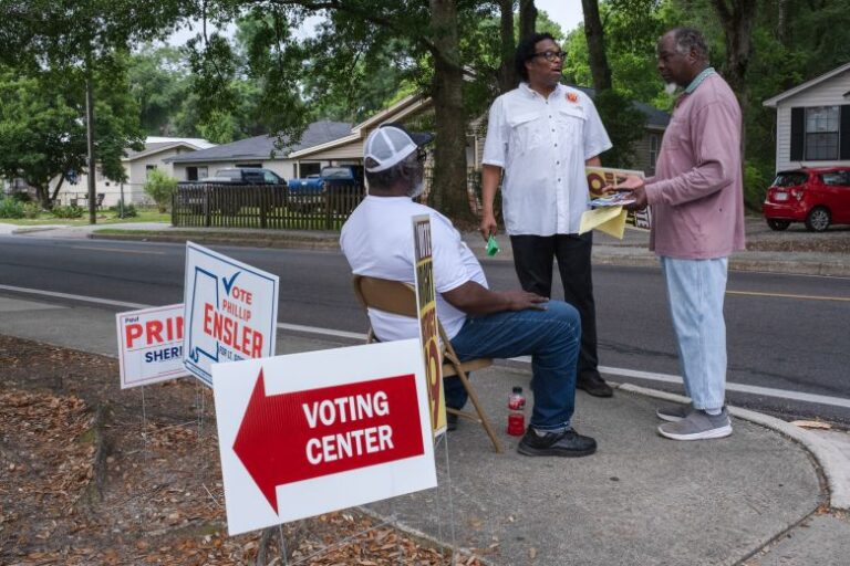Levi Wright Jr., Democratic state representative candidate for Alabama, center, outside a polling location in Mobile on Tuesday, May 19, 2026.