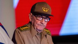 Former Cuban President Raul Castro looks at the Cuban flag during his speech at the event celebrating the 65th anniversary of the triumph of the revolution in Santiago, Cuba, on January 1, 2024.