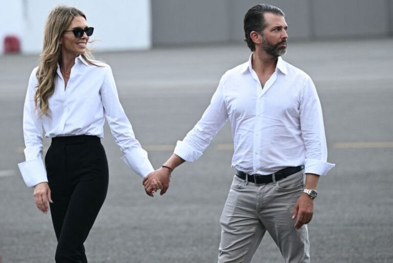 Bettina Anderson and Donald Trump Jr. walk on the tarmac in Teterboro, New Jersey, on July 13, 2025