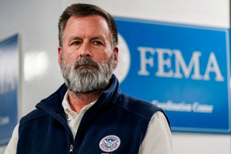 Office of Response and Recovery Director Gregg Phillips listens as US Secretary of Homeland Security Kristi Noem speaks during a news conference in the National Response Coordination Center at the Federal Emergency Management Agency (FEMA) headquarters on January 24 in Washington, DC.