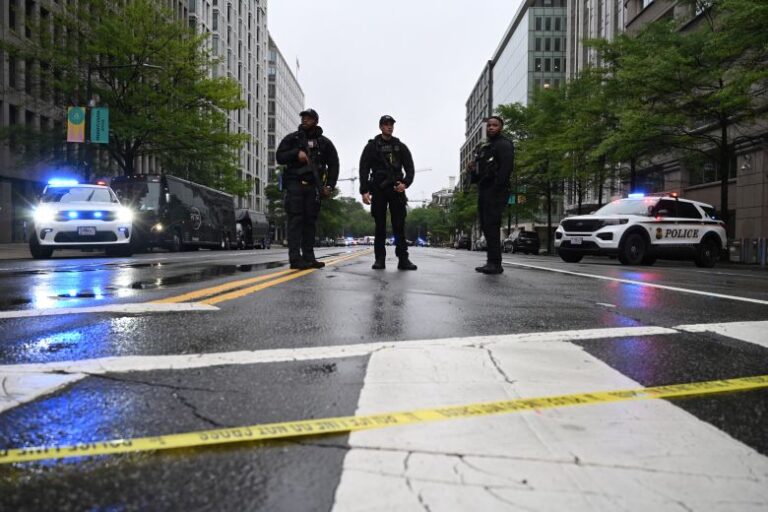 Police vehicles and armed Secret Service agents are seen on a blocked street near the White House in Washington, DC, on May 23.