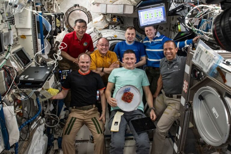 Mike Fincke, second from the left in the top row, with the rest of the Expedition 74 crew aboard the ISS, a few weeks before he experienced a medical episode.