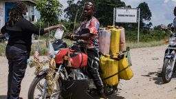 TOPSHOT - A port health officer sanitizes the hands of a motorbike rider transporting goods across the border between Uganda and the Democratic Republic of Congo at the Busunga border crossing in Bundibugyo, on May 18, 2026. Ugandan officials confirmed that a 59-year-old man from Democratic Republic of Congo had died in Kampala after being admitted earlier in the week. Tests showed the victim in Uganda was infected with the Bundibugyo strain of Ebola, first identified in 2007.
The World Health Organization declared an international health emergency on May 17, 2026 over an outbreak of an Ebola strain in the Democratic Republic of Congo that has killed more than 80 and for which there is no vaccine. Fears of further spread grew when a laboratory confirmed a case in the major eastern DRC city of Goma, which is controlled by the Rwanda-backed M23 militia. (Photo by Badru Katumba / AFP via Getty Images)