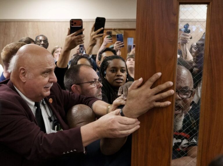 Protesters try to enter the room during a public hearing on redistricting as Louisiana Republicans pursue a new congressional map ahead of the November midterm elections, in Baton Rouge on May 8, 2026.