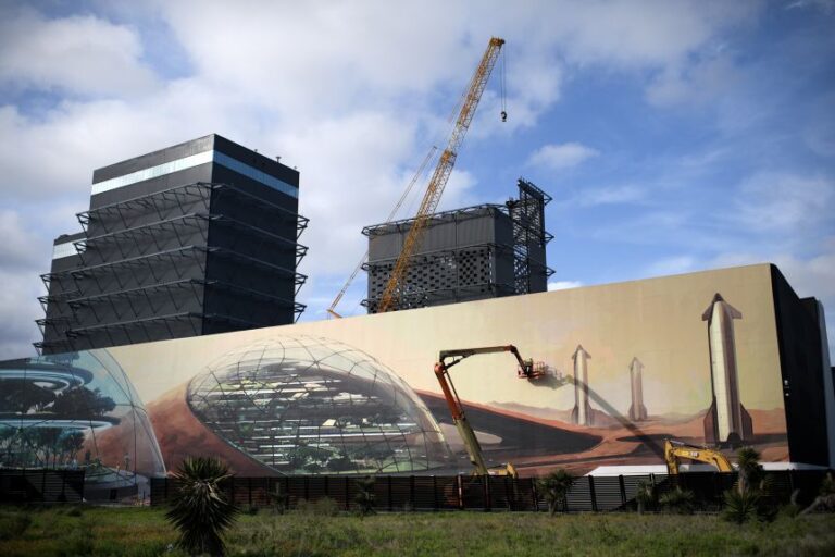 A mural outside of the SpaceX Starbase industrial complex and rocket launch facility in Boca Chica, Texas, as seen in April 2025, depicts rockets on Mars.