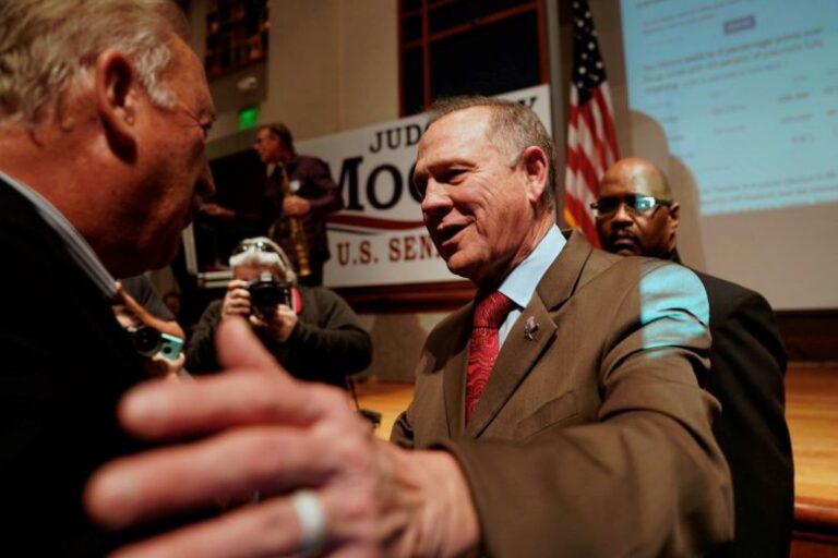 Republican Senate candidate Roy Moore is greeted by supporters as he arrives at his election night party in Montgomery, Alabama, December 12, 2017.