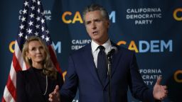 California Gov. Gavin Newsom speaks as his wife Jennifer Siebel Newsom looks on during an election night gathering at the California Democrats headquarters on November 4, 2025 in Sacramento, California.