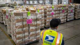 In this October 2020 photo, Jim Slowikowski oversees the unloading of pallets filled with Washington and Oregon mail-in ballots at a US Postal Service processing and distribution center in Portland, Oregon.