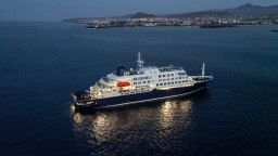 A general view of the cruise ship MV Hondius, while stationary off the port of Praia, the capital of Cape Verde, on May 6, 2026. Two seriously ill crew members on a cruise ship stricken by a deadly hantavirus outbreak will be evacuated via Cape Verde to the Netherlands, allowing the vessel to sail on to Spain's Canary Islands, the ship operator said on May 5, 2026.
