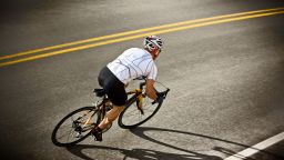 Cyclist is on road at the Colorado National Monument near Grand Junction.