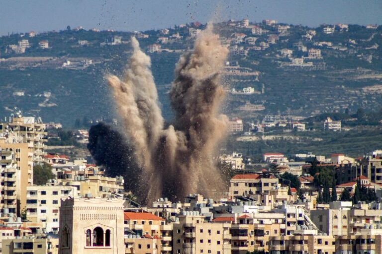 An explosion erupts in the area of al-Housh following Israeli bombardment as seen from Tyre in southern Lebanon on May 12.