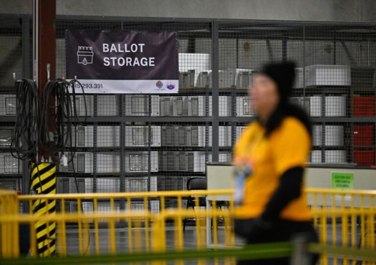 An election worker walks by a ballot storage area at the Clark County Election Department after polls closed on Election Day in North Las Vegas, Nevada, November 5, 2024.