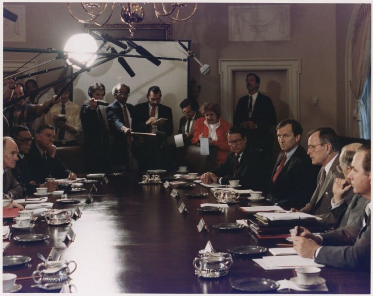 President George H. W. Bush participates in a full National Security Council meeting regrading Iraq's invasion of Kuwait on August 2, 1990.