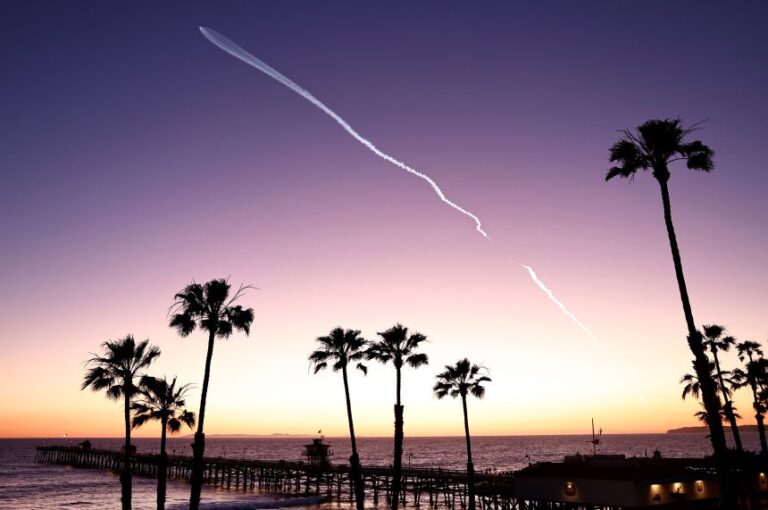 A SpaceX Falcon 9 rocket flies above the Pacific Ocean carrying a payload of Starlink satellites after launching from Vandenberg Space Force Base in April 2024.