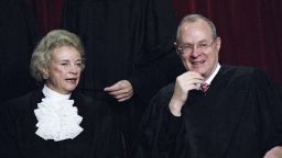 Associate Supreme Court Justices Sandra Day O' Connor and Anthony Kennedy chat as the entire court has their portrait taken on November 10, 1994 in Washington.