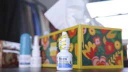 Alaway antihistamine eye drops in front of a box of tissues and other allergy remedies