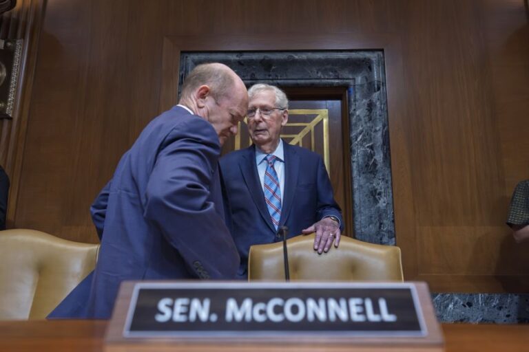 Sen. Mitch McConnell, right, confers with Sen. Chris Coons as they prepare to hear President Donald Trump's funding requests for the Army at the Capitol on May 19, 2026.
