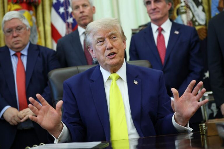 President Donald Trump looks on during a