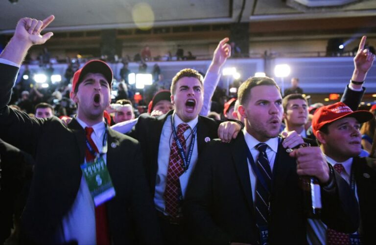 Supporters of then-nominee Donald Trump react to early election results in the 2016 presidential election, at the New York Hilton Midtown.