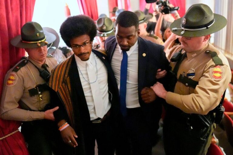 Tennessee State Rep. Justin Pearson of Memphis, second from left, walks with his brother KeShaun Pearson, as he is arrested and removed from the House gallery during a special session of the state legislature to redraw US congressional voting maps on May 7 in Nashville.