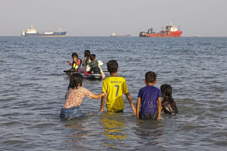 In this picture obtained from Iran's ISNA news agency on June 1, 2026, Iranians swim at Suru Beach in Bandar Abbas along the Strait of Hormuz.