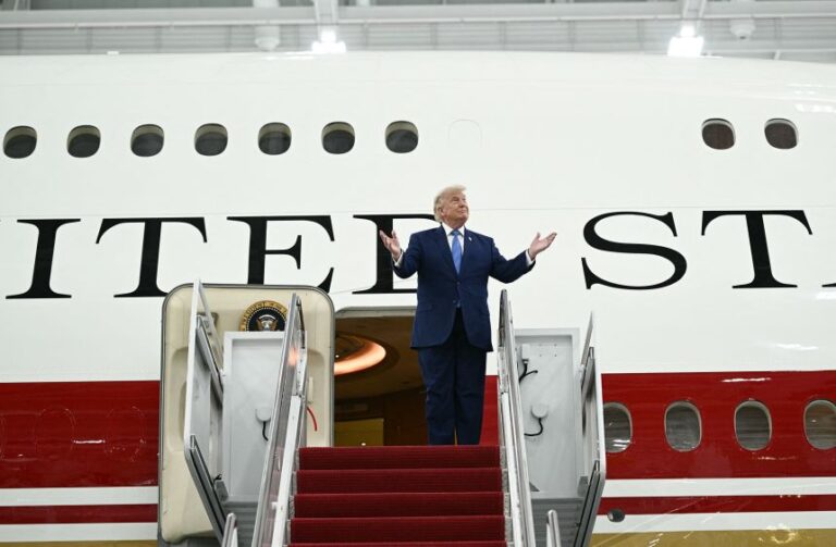 President Donald Trump steps out of the new Air Force One, in a hangar at Joint Base Andrews, Maryland on June 19, 2026.